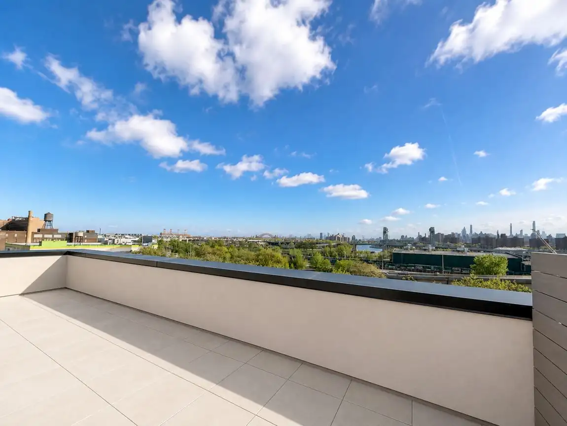 Waterfront terrace with open sky and river view
