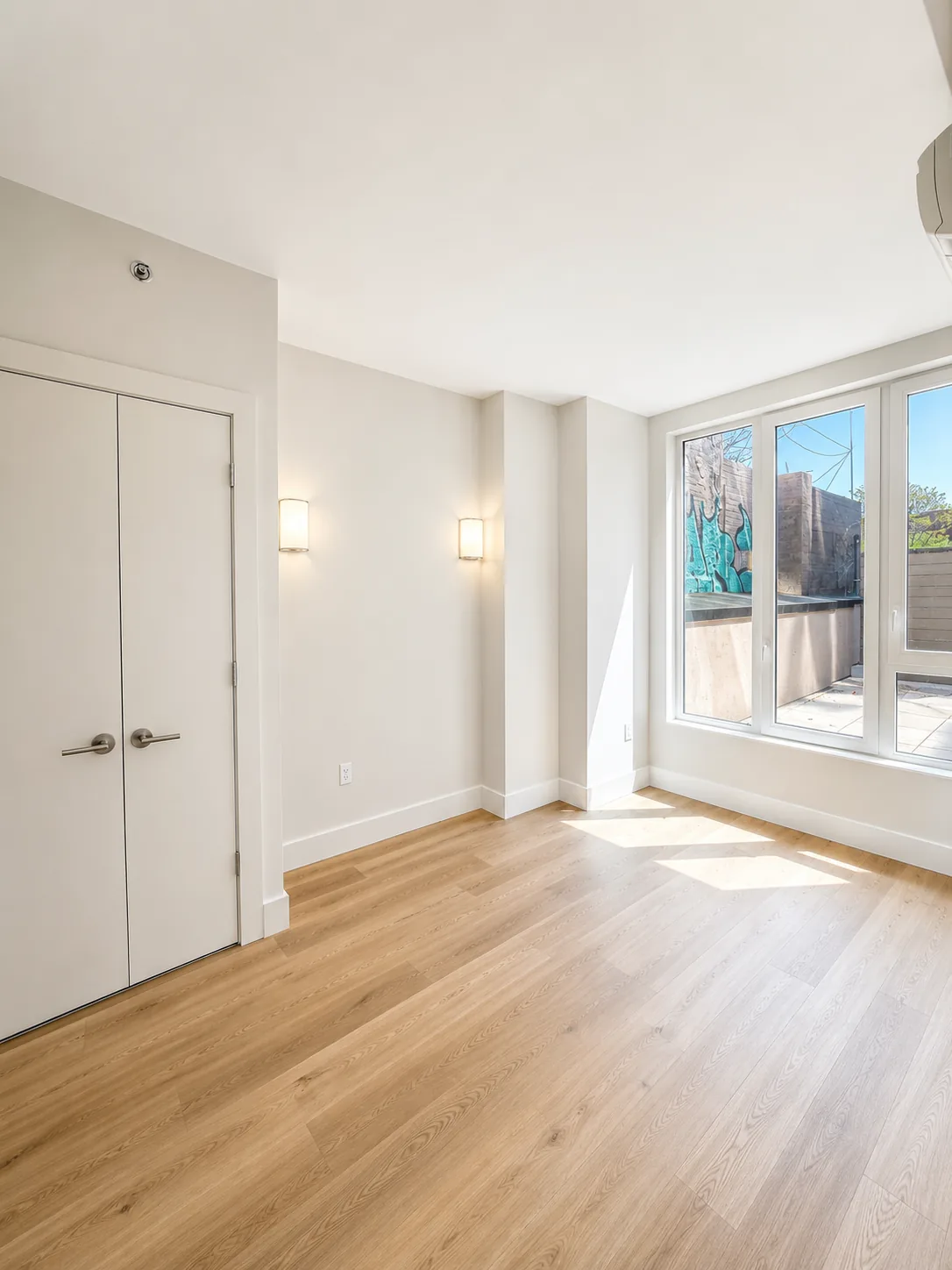 Residence 202 bright room with courtyard-facing windows