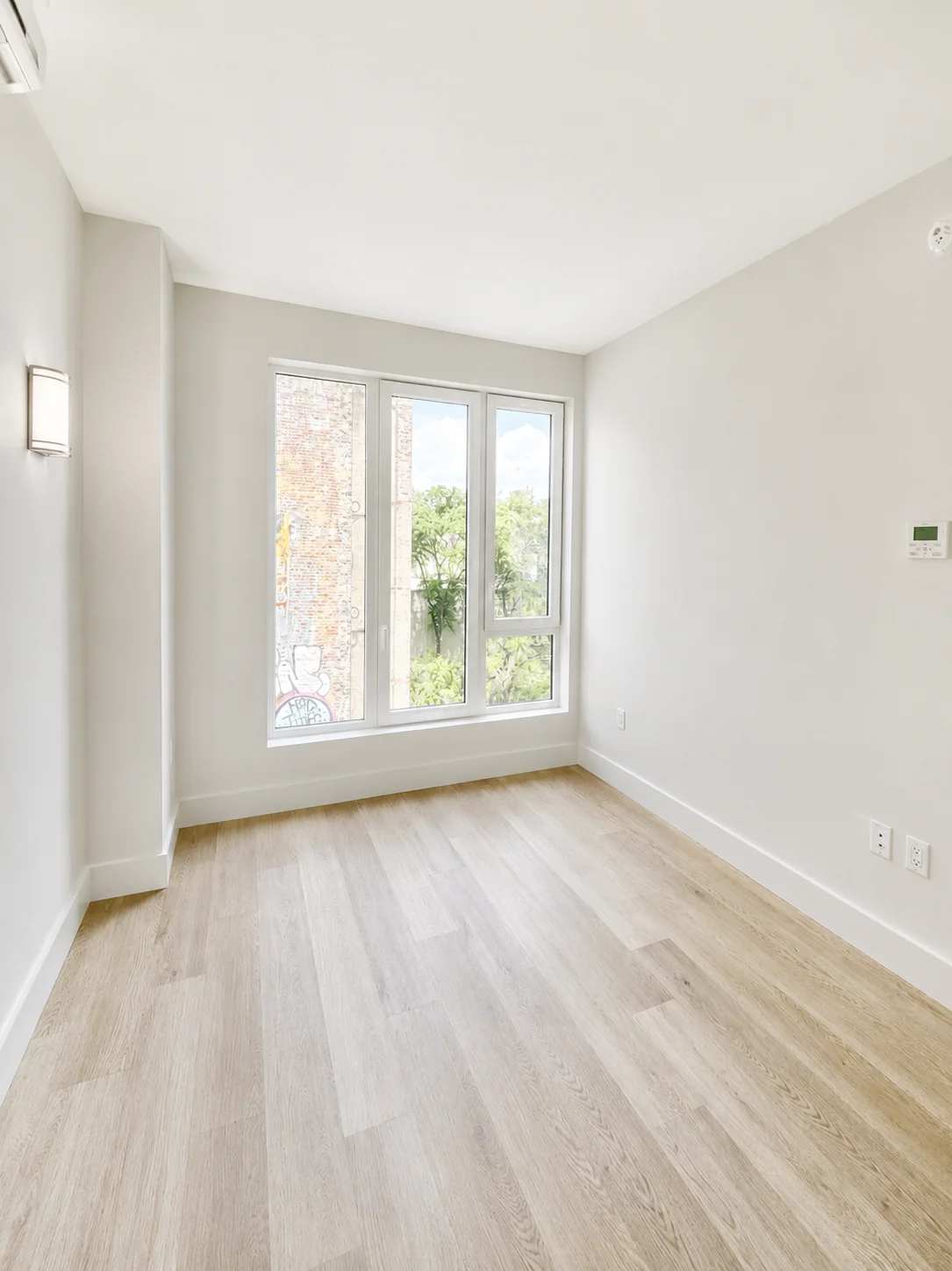 Residence 601 bedroom with floor-to-ceiling windows